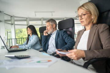 Male business leader presenting ideas to a diverse team in startup meeting