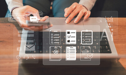 Hands using smartphone and laptop with chatbot icons overlay. Concept of online customer support with AI assistant, CRM tools, and digital communication for efficient client service