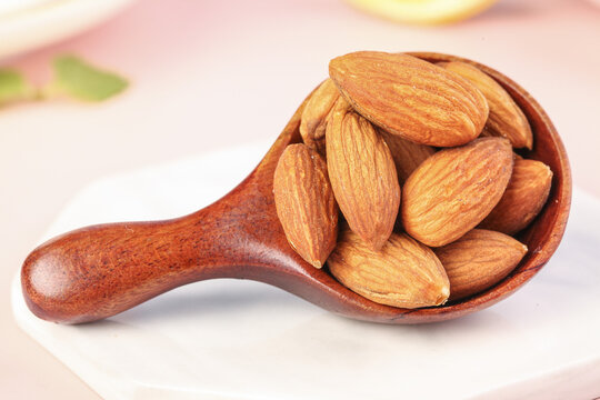 Peeled Almonds in Wooden Scoop - Healthy Nuts Snack
