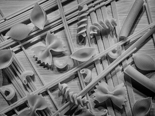   B&W of assorted dry pasta.