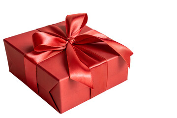 Fototapeta premium A vibrant red gift box, meticulously wrapped with a lustrous satin ribbon and bow, ready to convey heartfelt sentiments for any memorable occasion or joyous celebration