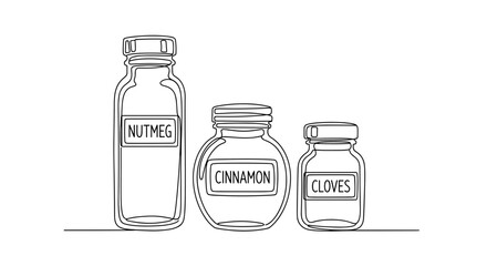Three glass spice jars labeled nutmeg, cinnamon, and cloves  