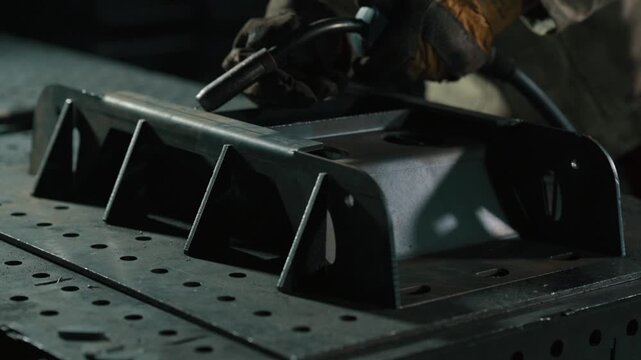 Welding of steels with Mig welding. Close up of hands. Slow motion.