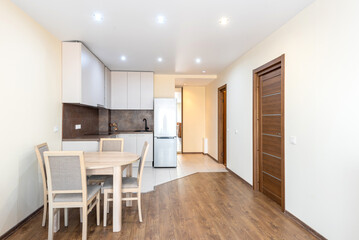 Modern Open Plan Kitchen and Dining Room Interior with Wooden Accents