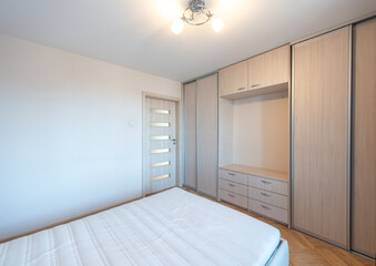 Modern Home Bedroom With Neat Decor and Simple Furniture Arrangement