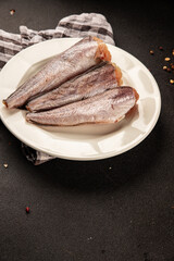 Hake raw fish seafood healthy food main course ingredient appetizer fresh delicious gourmet food table setting rustic food top view copy space pescatarian diet