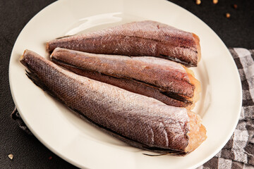 Hake raw fish seafood healthy food main course ingredient appetizer fresh delicious gourmet food table setting rustic food top view copy space pescatarian diet