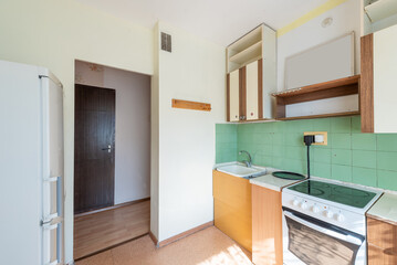 Vintage Kitchen with Old Cabinets and Bright Window Lighting