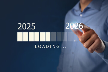 Businessman using virtual screen with loading bar on dark blue background, closeup. New Year 2026