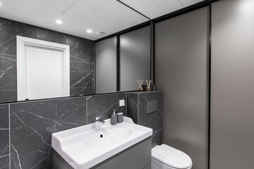 Modern Clean Bathroom Interior With Sink, Mirror, and Marble Walls