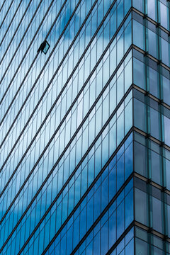Corporate architecture facade glass reflection abstract geometry lines modern pattern generating forward-looking business identity through refined structure