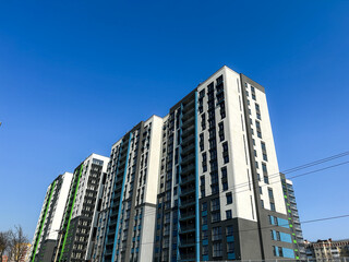 Modern newly built residential apartment building. Multi story apartment complex with fresh facade. Urban development and modern living concept. Horizontal, high quality.