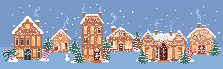 Cute gingerbread village with snowy cookie houses, winter trees and falling snow on a blue night background. Ideal for holiday illustrations and greeting cards
