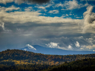 Sunny Autumn Carpathians with Puffy White Clouds