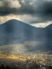 Sunny Autumn Carpathians with Puffy White Clouds