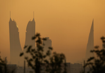 Fototapeta premium Silhouette of Iconic buildings of Bahrain during sunrise.