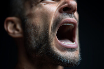 Obraz premium A man with a beard and a mouth wide open