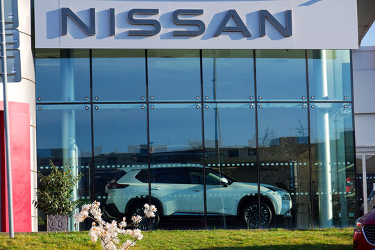 Nissan motor company logo in front of dealership building on April 12, 2025 in Prague, Czech republic.