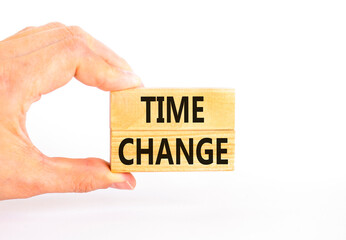 Time change symbol. Concept word Time change on beautiful wooden blocks. Beautiful white paper background. Businessman's hand. Business time change concept. Copy space.