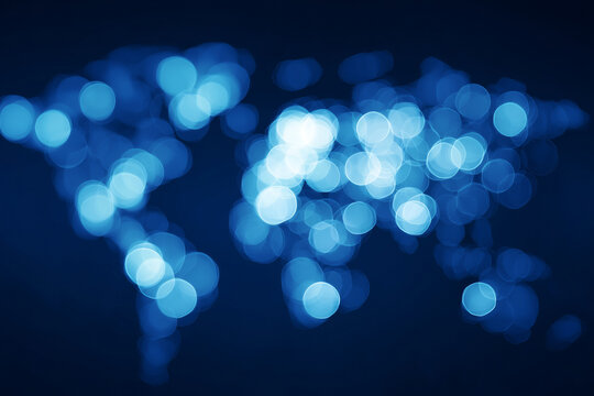 Abstract world map illuminated with soft blue bokeh lights highlighting the connections between continents and representing global communication and data exchange - Powered by Adobe
