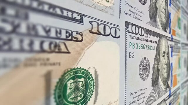 Movement over 100 dollar bills with a soft blur effect creating an exclusive investment focused business background that highlights flowing money motion and subtle dynamic cash transitions