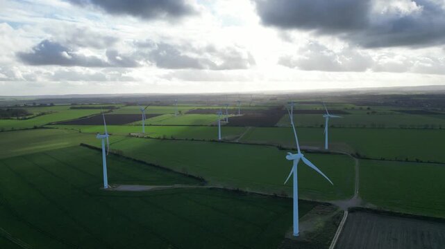 Drone aerial footage of wind turbines at Biggleswade Wind Farm, UK, showing clean energy, renewable power and countryside landscape.