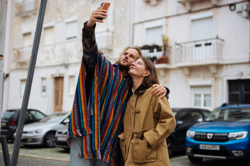 Pair documenting city adventures through vibrant smartphone images