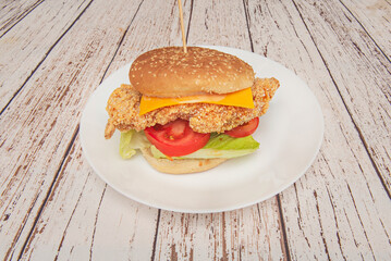 Served on a wooden board, this feast features a juicy burger topped with smoky cheddar alongside a cone of perfectly golden fries