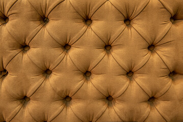 Fototapeta premium tufted seat back in camel-colored leather