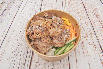 Chinese-style fried pork ribs with hoisin and honey sauce, accompanied by steamed broccoli and jasmine rice with chives
