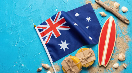 Flatlay of the Australian flag with surfboard, shells, and natural elements on a blue background