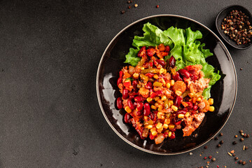 Mexican salad tuna, red beans, corn, peppers, vegetable oil seafood healthy food main course ingredient appetizer fresh tasty food table background country food top view copy space vegetarian food