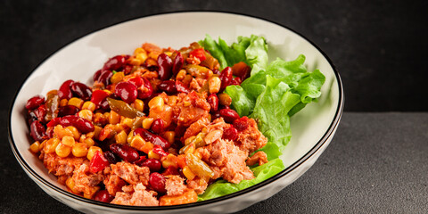 Mexican salad tuna, red beans, corn, peppers, vegetable oil seafood healthy food main course ingredient appetizer fresh tasty food table background country food top view copy space vegetarian food