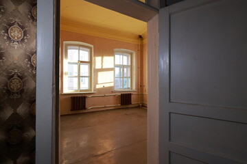 empty room with a window. view through opened door