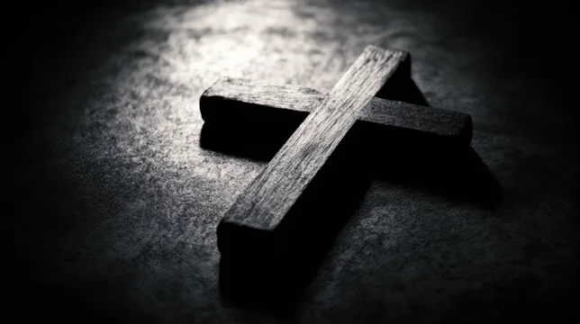 Stark Shadow Falling Across Old Wooden Cross