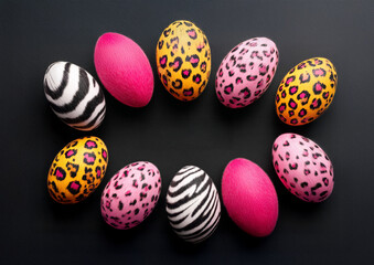 Fototapeta premium Colorful Furry Animal-Print Eggs Arranged on Dark Background