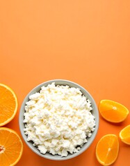 Cottage cheese in a bowl with oranges