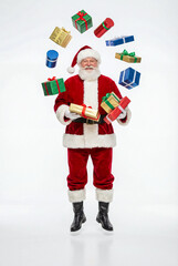 A jolly Santa Claus is juggling nine gifts, including boxes and cylindrical items, creating a busy circle of presents.