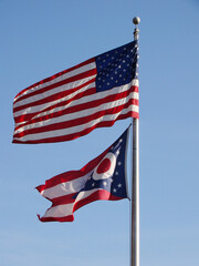 American flag and Ohio State flag on pole