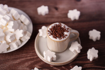 aesthetic coffee moment with chocolate sprinkles and star-shaped marshmallows on wooden surface enhances cozy atmosphere, rustic, aesthetic, vintage, arrangement, composition, decor, chocolate