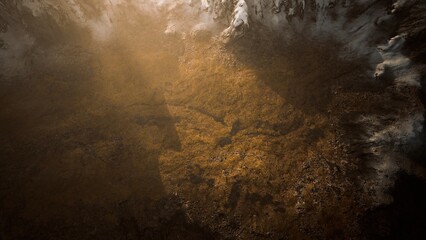 Overhead view showcases a stunning blend of golden earth and rocky textures, bathed in soft sunlight. The interplay of shadows and light highlights the beauty of untouched nature.