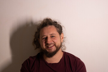 Bearded man smiling creating cheerful positive expression