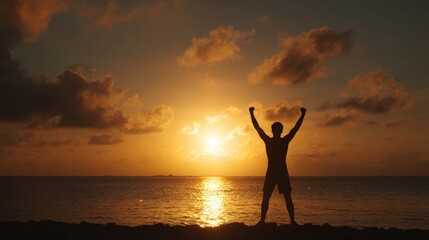 Fototapeta premium Silhouette of Athlete Celebrating Victory at Sunrise by the Sea