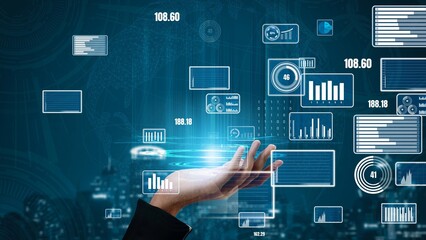 A hand reaching towards a futuristic digital interface filled with various data visualizations and graphs, symbolizing advanced analytics and technological innovation in business environments. Xenic