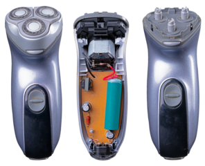 An electric razor for men's beards on an isolated background. The case is open, revealing the internal components.