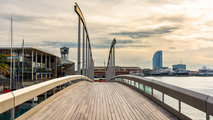 Walkway and drawbridge to access the shopping center of the marina of Barcelona, Spain.