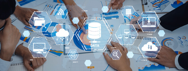 Business team engaged in data analysis, exploring visual charts and technology icons, focusing on strategy development and decision-making processes to enhance productivity. Trope