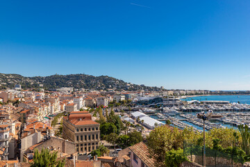 Obraz premium Aerial view of old european city on Cote d'azur seashore on sunny day, Cannes, France
