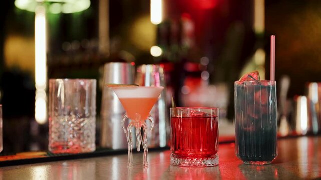 Refreshing cocktails standing on a bar counter in a nightclub