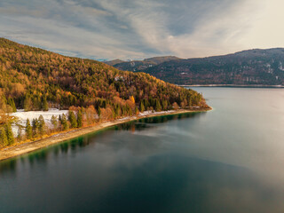 Fototapeta premium A golden hour view to the Walchensee at the lake region of Bavaria during winter season